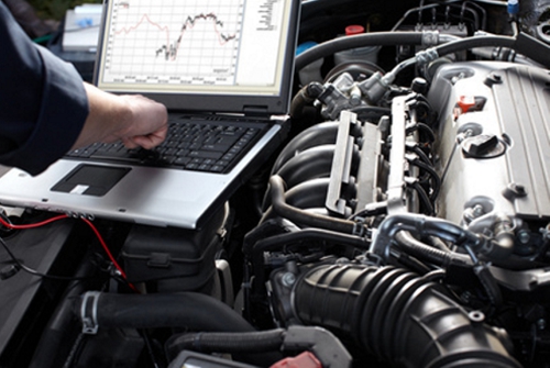 mechanic-performing-diagnostic-tests-on-a-vehicle